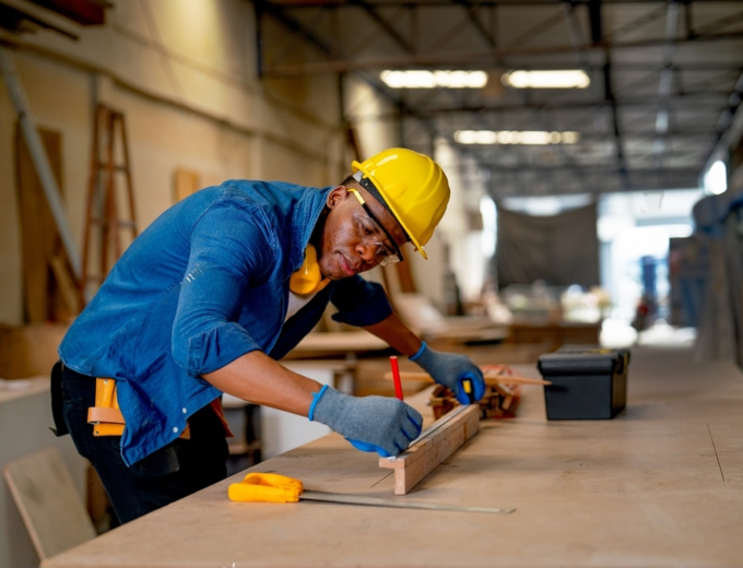 stock-photo-african-american-carpenter-man-use-pencil-to-mark-on-timber-during-work-with-in-wood-factory-2251271317-transformed